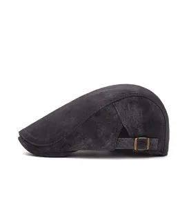 Side view of dark grey suede newsboy hat with adjustable metal buckle detail