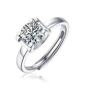 Macro shot of silver S925 ring with round moissanite in square four-prong setting