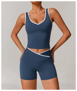 Detailed view of the gray-blue yoga set featuring white contrast binding and V-neckline