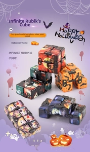 Macro shot of Halloween infinity cube featuring festive pumpkin and ghost patterns