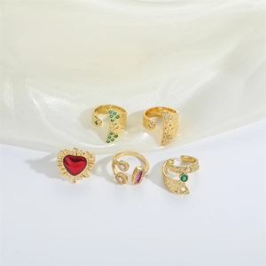 Five-piece vintage gold-tone ring set featuring red enamel hearts and colorful zircons