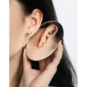 Minimalist liquid metal molten stud earrings in gold with mirror reflection effect