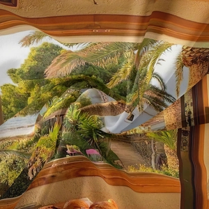 Detail of bohemian tropical landscape tapestry with soft silky fabric and palm tree prints