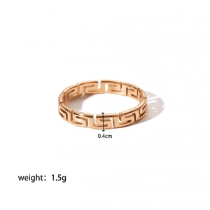 Detail shot of 18K gold plated stainless steel ring with Greek key pattern and 0.4cm width