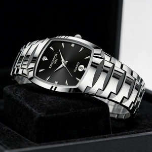Close-up of a silver quartz watch with a black square dial on a display cushion