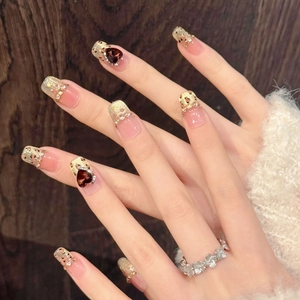Autumn leopard print press-on nails with golden glitter, cat eye finish and red heart rhinestones