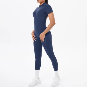 Detail of navy blue athletic jumpsuit with front zipper and high-stretch performance fabric
