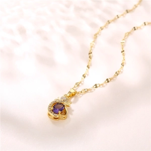 Elegant gold necklace with purple gemstone flower pendant and zircon accents on light background