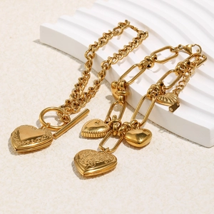 Gold stainless steel Cuban chain bracelet with heart locket and OT toggle clasp