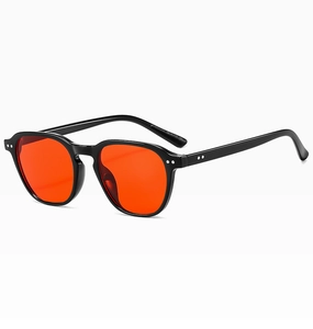 Detail of black sunglasses with orange lenses and silver metal rivets decoration