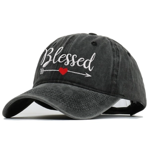 Washed black cotton baseball cap with white Blessed embroidery and red heart graphic