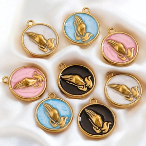 Round enamel prayer hands charms in assorted colors on soft satin fabric for DIY jewelry