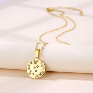 Close-up of a gold starburst pendant necklace with sparkling cubic zirconia on a soft roll