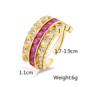 Detail view of gold-plated heart ring with red zircons and size measurements