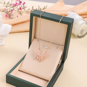 Micro-paved butterfly pendant necklace in rose gold displayed in a luxury gift box