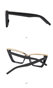 Detail view showing side and back of black cat-eye glasses with golden metal trim