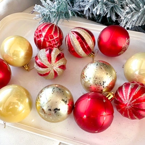 6cm red and gold Christmas ball ornaments with glitter and matte finishes on pine branches