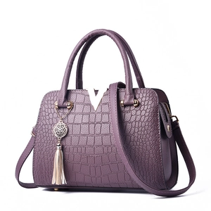 Elegant purple faux crocodile leather handbag with golden metal V-buckle and tassel decor