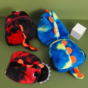 Detailed top view of tie-dye plush dinosaur backpacks and matching hats for kids