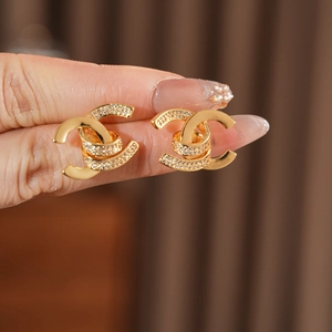 Close-up of 18k gold plated double C earrings with micro-pave cubic zirconia crystals