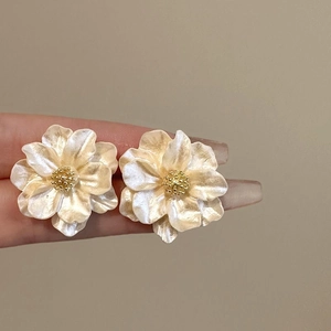 French vintage camellia flower stud earrings with pearlescent petals and golden stamens