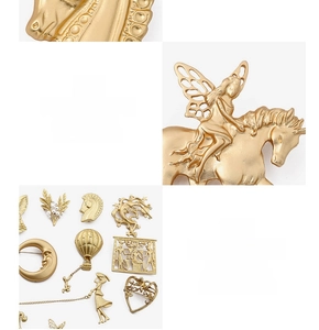 Detailed view of vintage matte gold baroque brooches with unique artistic patterns