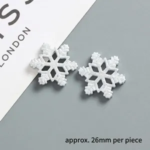 Glittering snowflake resin charm for DIY phone cases, measures approximately 26mm in size