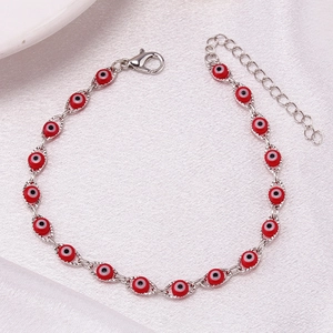 Detail of red Evil Eye beads with silver metal chain and adjustable lobster clasp