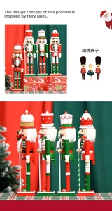Detail of wooden nutcracker soldier set with hand-painted festive red and green finish
