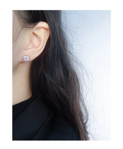Close-up of pink heart-shaped cubic zirconia stud earrings in S925 sterling silver