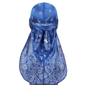 Blue paisley durag made of silky satin material shown on a mannequin from a back view