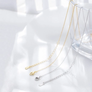 Detail of gold and silver S925 sterling silver chain with lobster clasp and extender