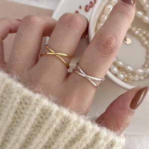 Minimalist 925 sterling silver layered cross ring in gold and silver finish on model