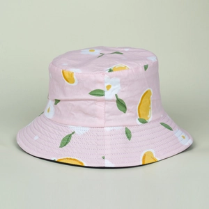 Detail of reversible sun hat showing pink floral print with mango patterns and black lining