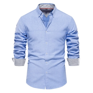 Close-up of light blue slim-fit casual shirt collar showing the size M tag and oxford fabric