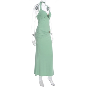 Detail view of mint green halter dress featuring star-shaped metal buckle and side ruched finish