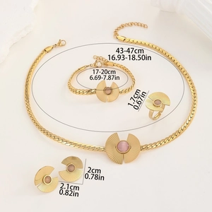 Luxurious gold jewelry set with pink cat eye stone necklace, bracelet, ring, and earrings