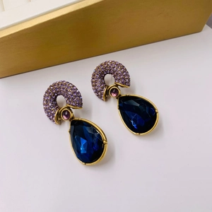 Vintage gold-plated drop earrings featuring navy blue crystals and purple accents