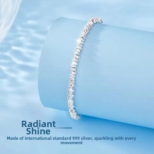 Detailed view of 999 sterling silver bracelet with irregular textured silver nuggets