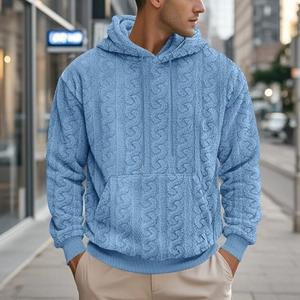 Detail of light blue men's hoodie showing high-quality jacquard teddy fleece texture
