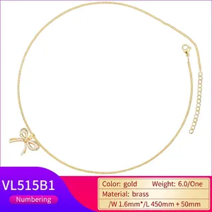 Elegant gold-plated brass bow necklace with pearl inlays and adjustable chain length
