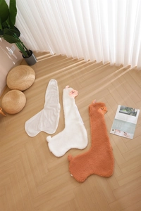 Details of alpaca plush toy shells in white and brown with inner liner fabric shown