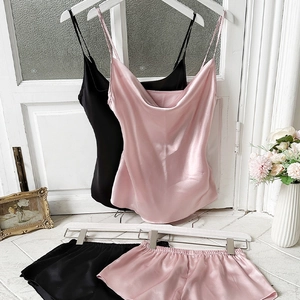Women's silk-like satin pajama set with cowl neck camisole and shorts in pink and black
