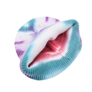 Close-up of tie-dye knit beanie showing detailed purple and blue ribbed texture and fold