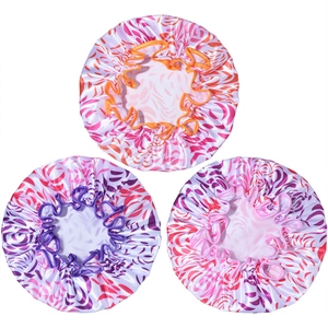 Three waterproof satin shower caps with animal stripes in orange, purple, and pink colors