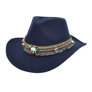 Detailed view of navy western hat with bohemian beaded band, turquoise, and grey fringe