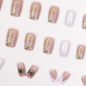 Elegant aurora gold foil press-on nails with green butterflies and French tip designs