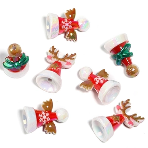 Christmas themed beaded DIY accessories with reindeer and angel wings on white background