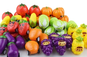 Assorted vegetable and fruit pull-back toy cars with cute cartoon faces on white background
