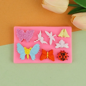 Macro detail of insect silicone mold featuring butterflies and dragonflies for cake decor